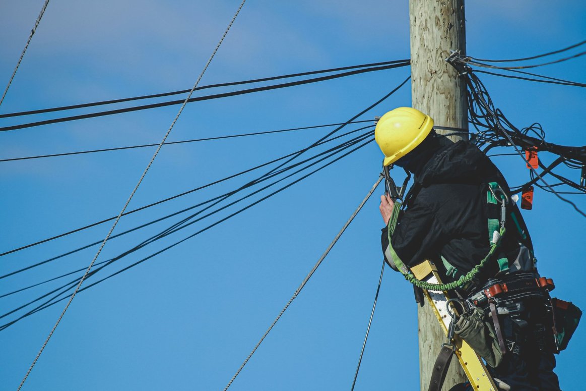 Utility worker doing maintenance during power outage
