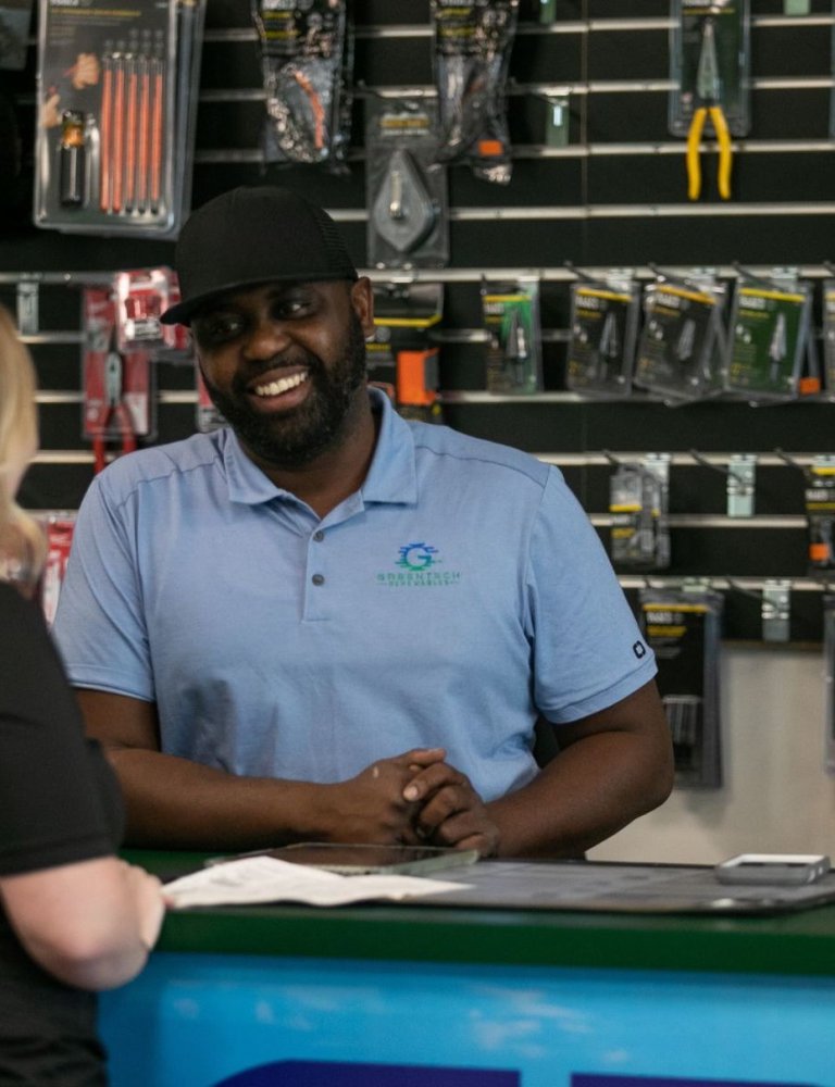 Greentech Renewables Employee Smiling at Front Desk