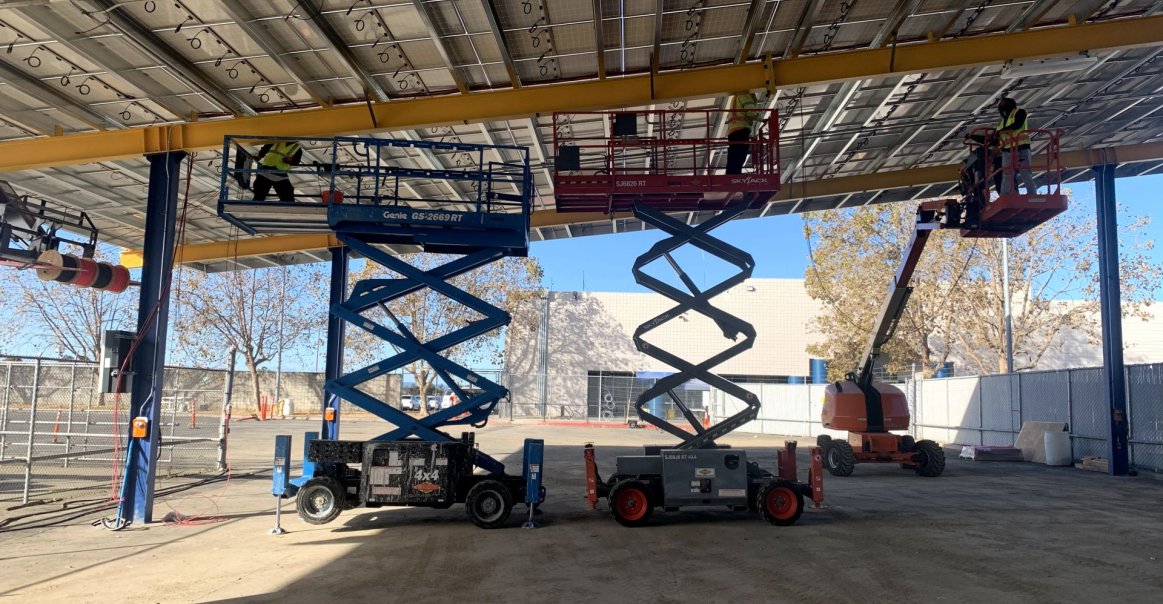 Cranes Under the Solar Car Port During Construction.